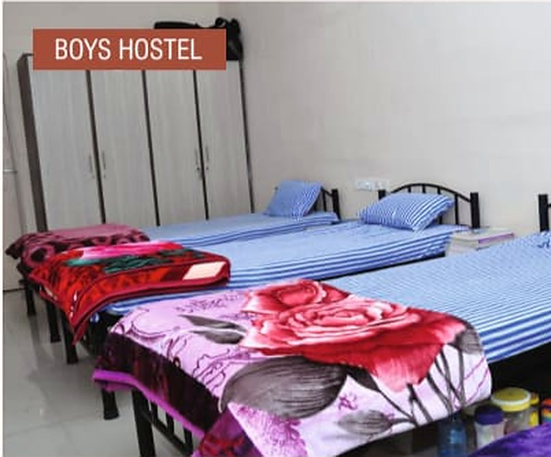Neat beds inside the Adyant boys hostel room